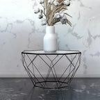 Tavolino moderno ottagonale in vetro con base geometrica in metallo